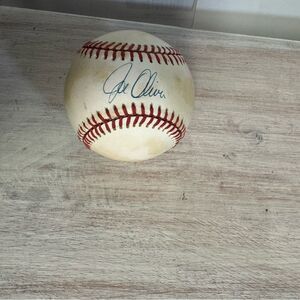 Autographed Baseball with Red Stitching signed by Joe Oliver for the Reds